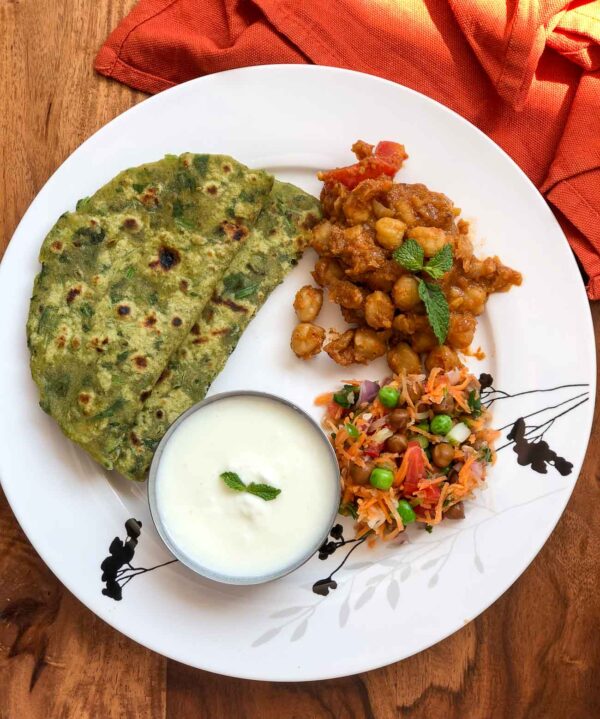 Palak paratha with chole or omelette pickle on side with karak tea